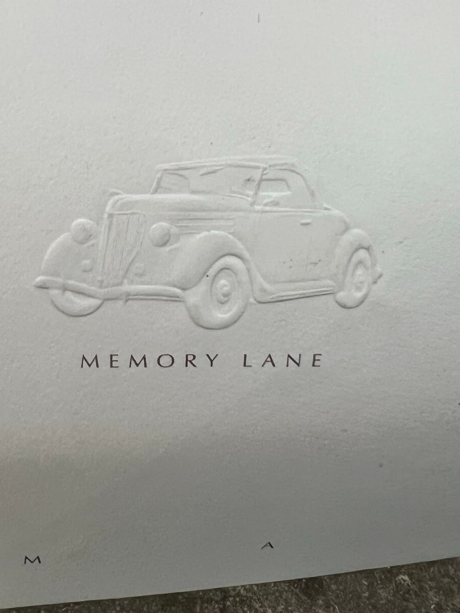 Memory Lane lettering pressed into paper, no ink