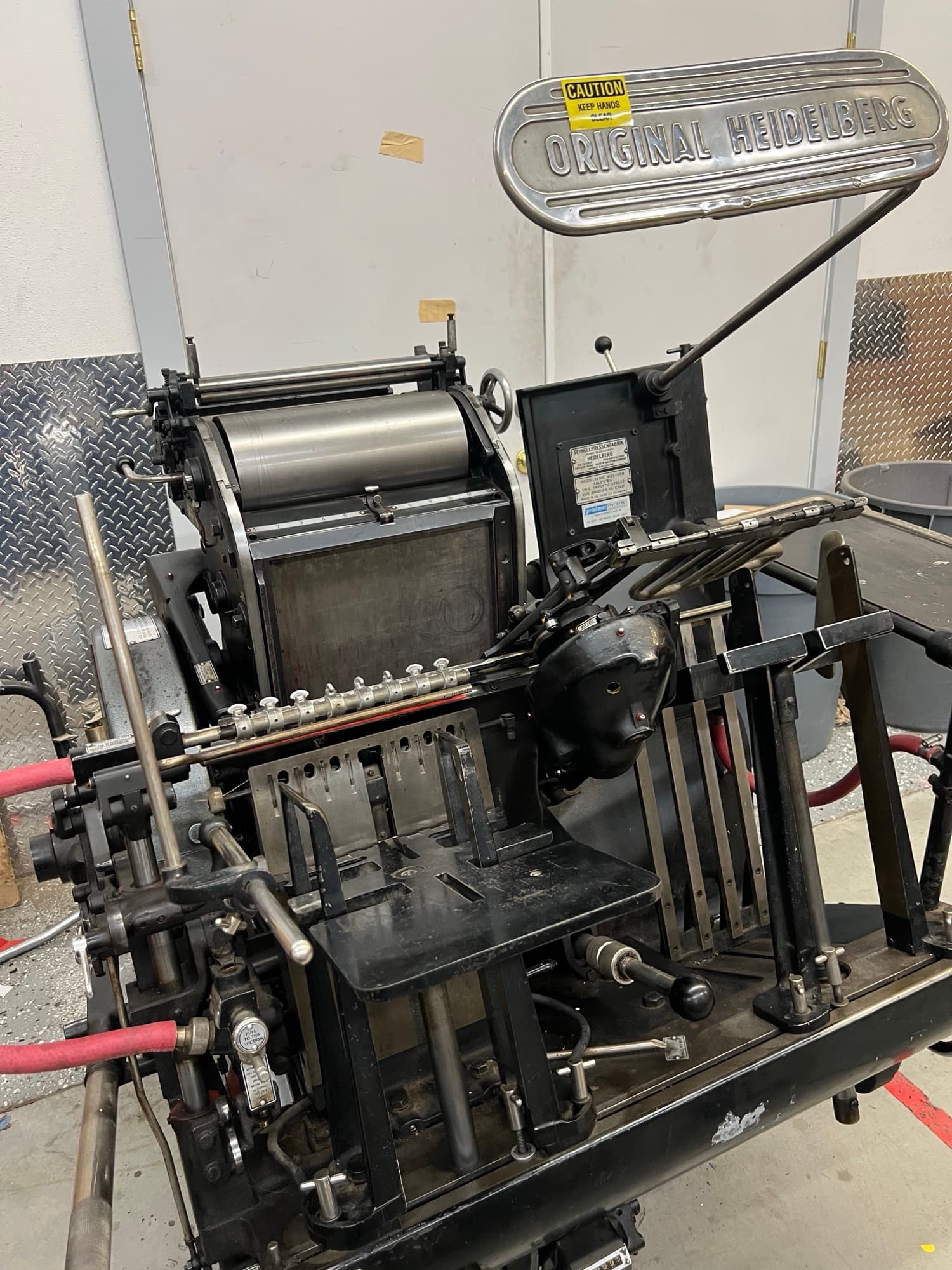 The Heidelberg Windmill press in operation on the shop floor