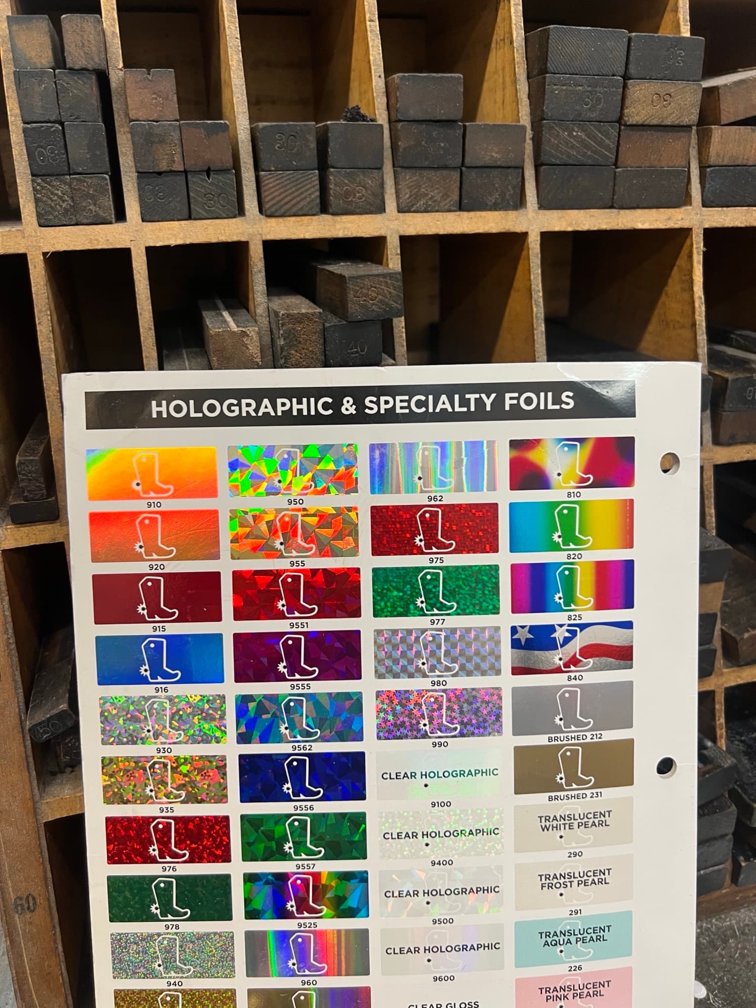 Swatch book pages showing holographic and specialty foil samples